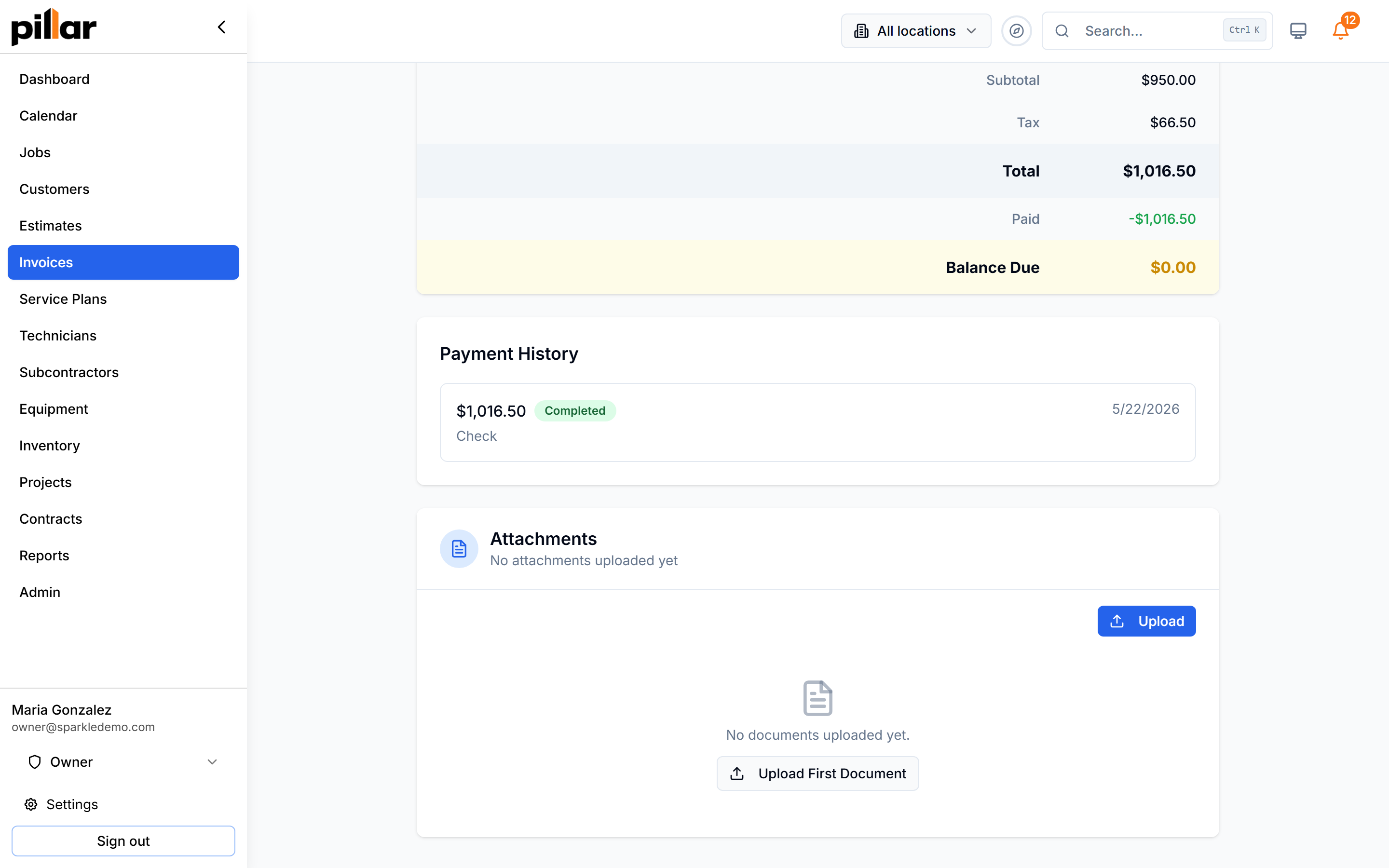 A paid invoice showing the payment history list with a completed check payment